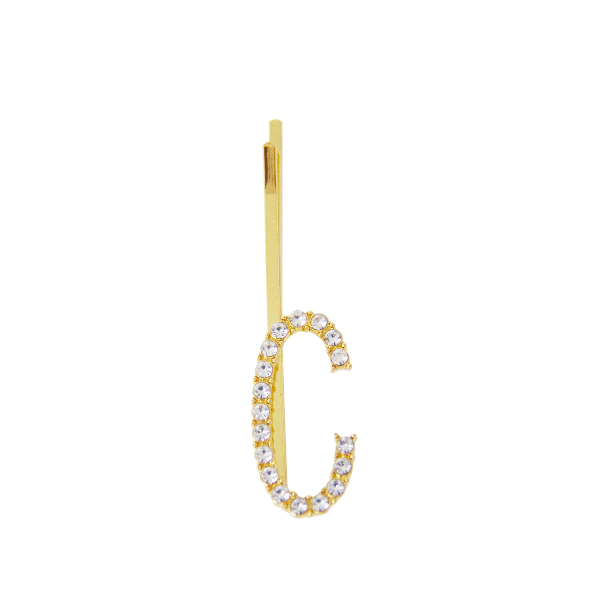 Gold and crystal letter 'C' hair slide on a white background