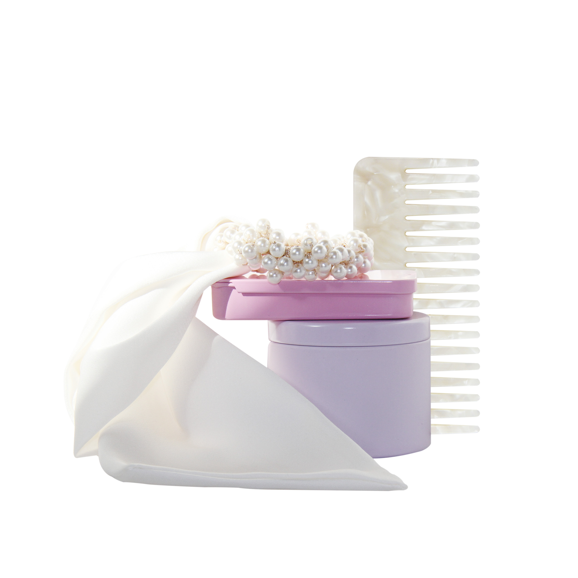 Braid & Bow Gift Set, a stack of colourful tins containing mini hair claws, non crease hair claws, a pearl and ribbon hair tie and wide tooth resin comb, on a white background