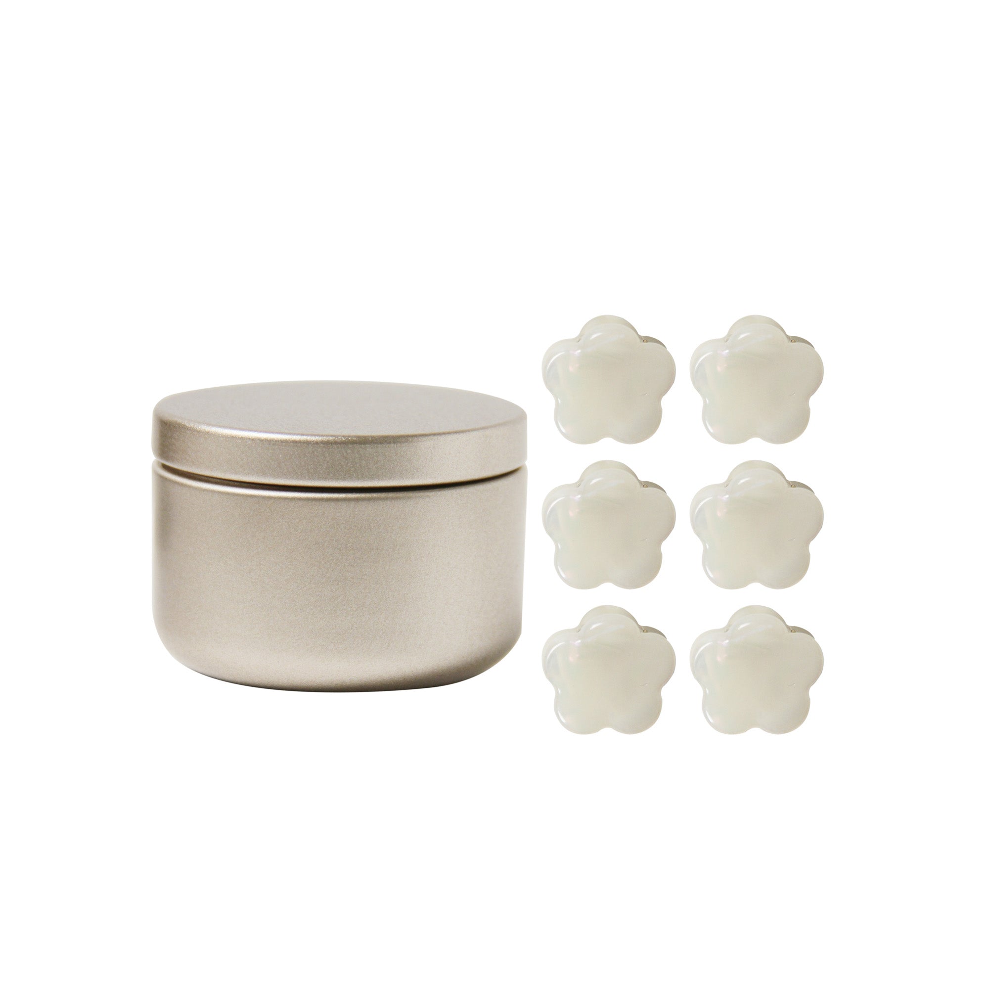 set of 6 mini hair claws next to the gold tin they come in on a white background