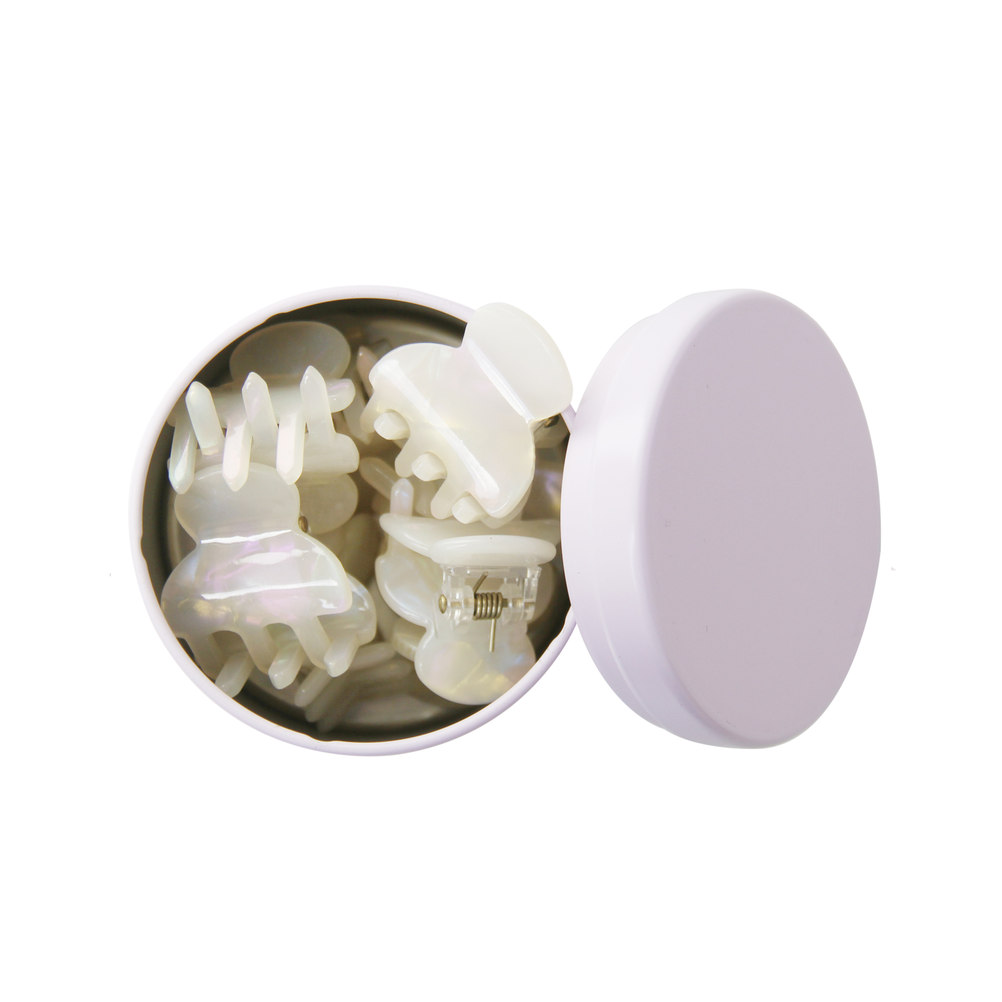 set of 8 mini pearlised resin hair claws in an open purple tin on a whitet background