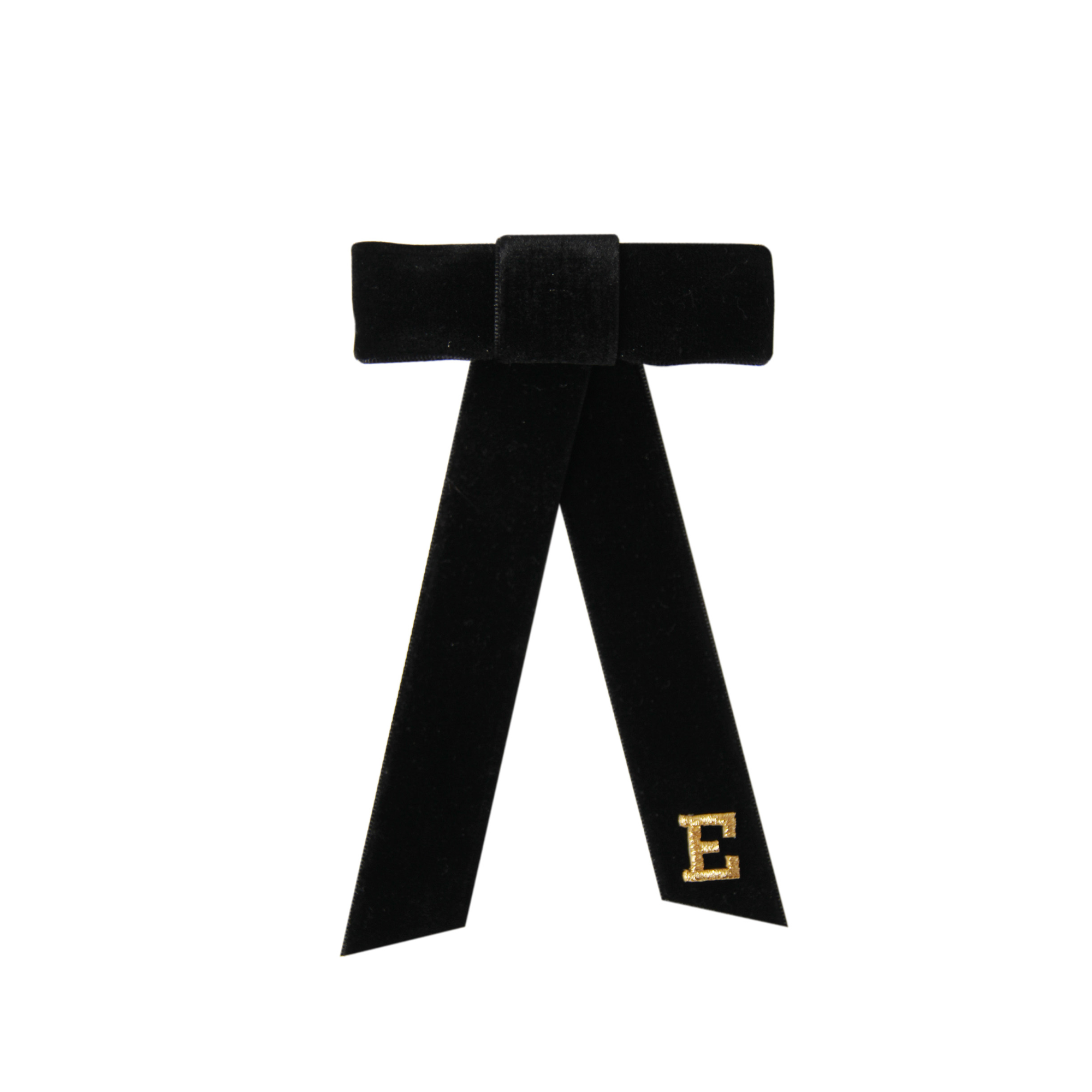 Monogrammed black velvet hair bow with gold letter 'E' on a white background