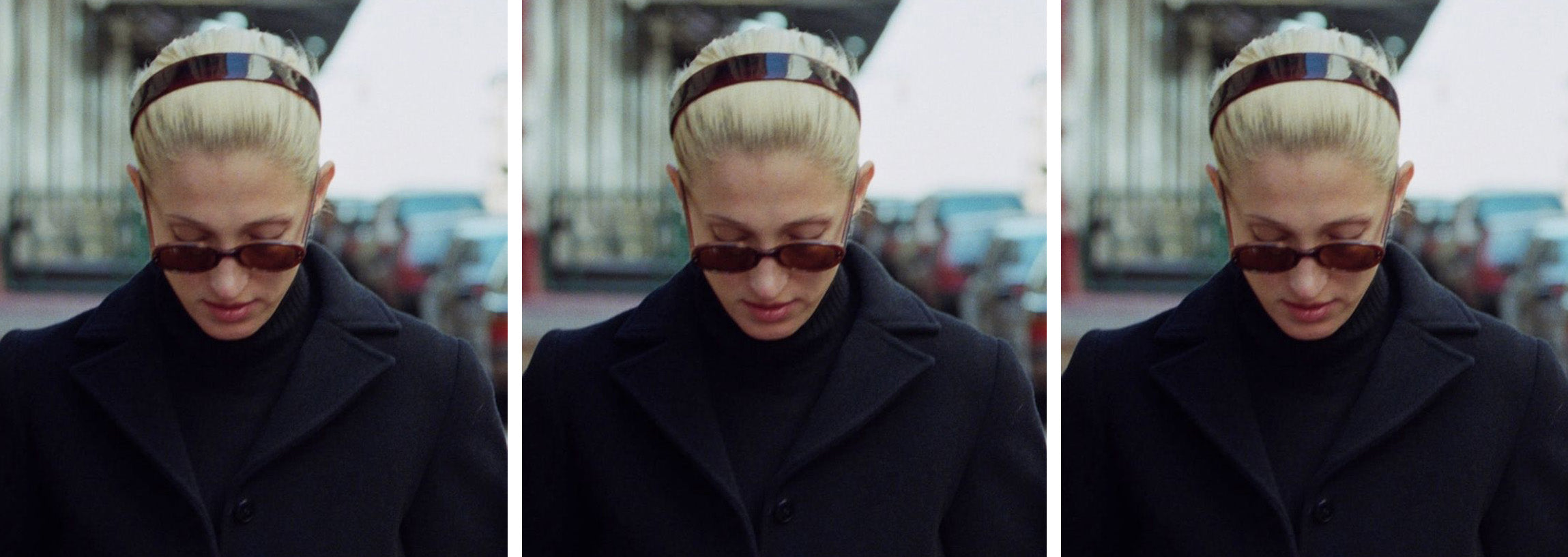 A picture of Carolyn Bassette-Kennedy, with her blonde her pull back and she's wearing a tortoiseshell resin hairband, she's wearing a winter coat and walking in New York