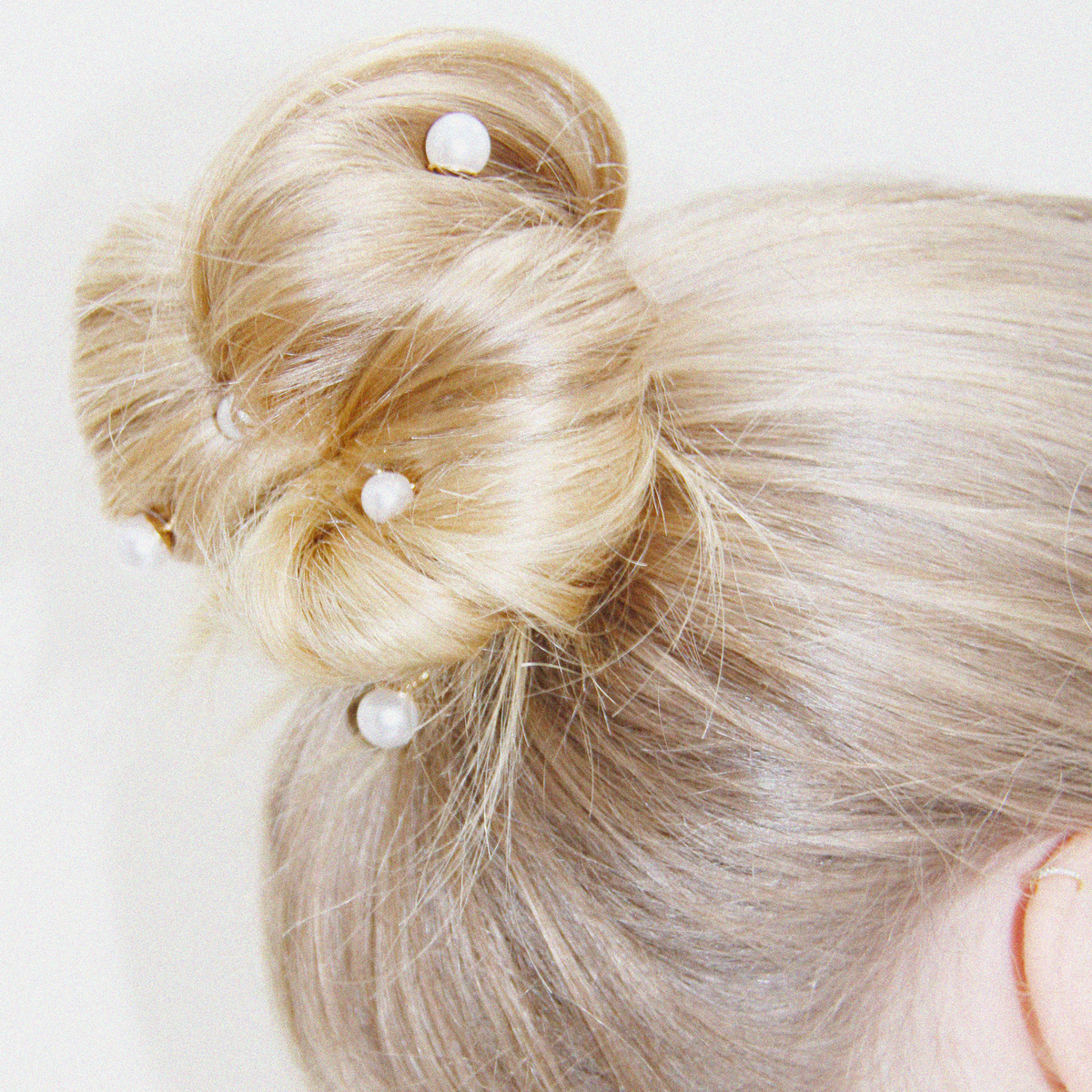 Pearl Hair Pins being worn in an effortless blonde updo