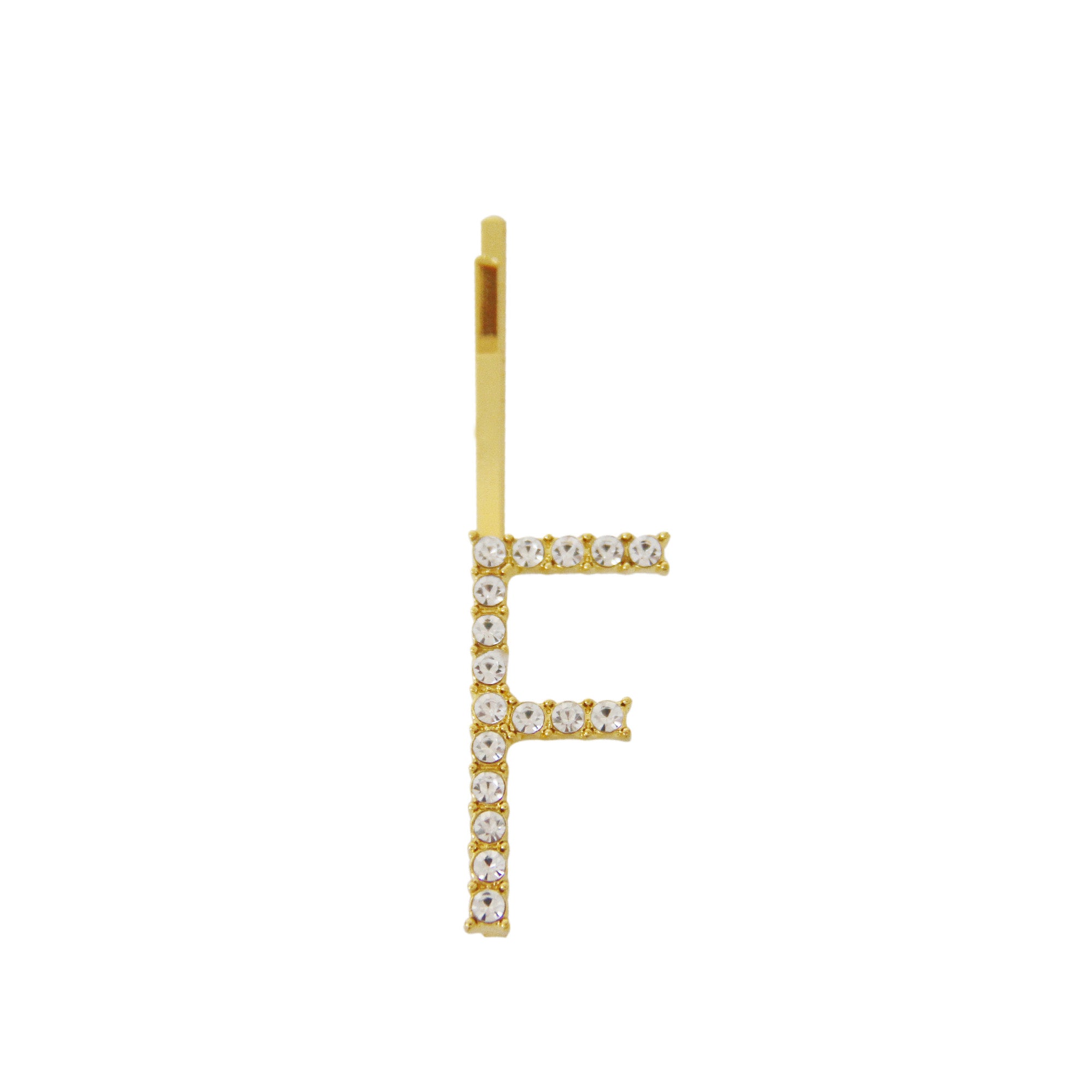 Gold and crystal letter 'F' hair slide on a white background