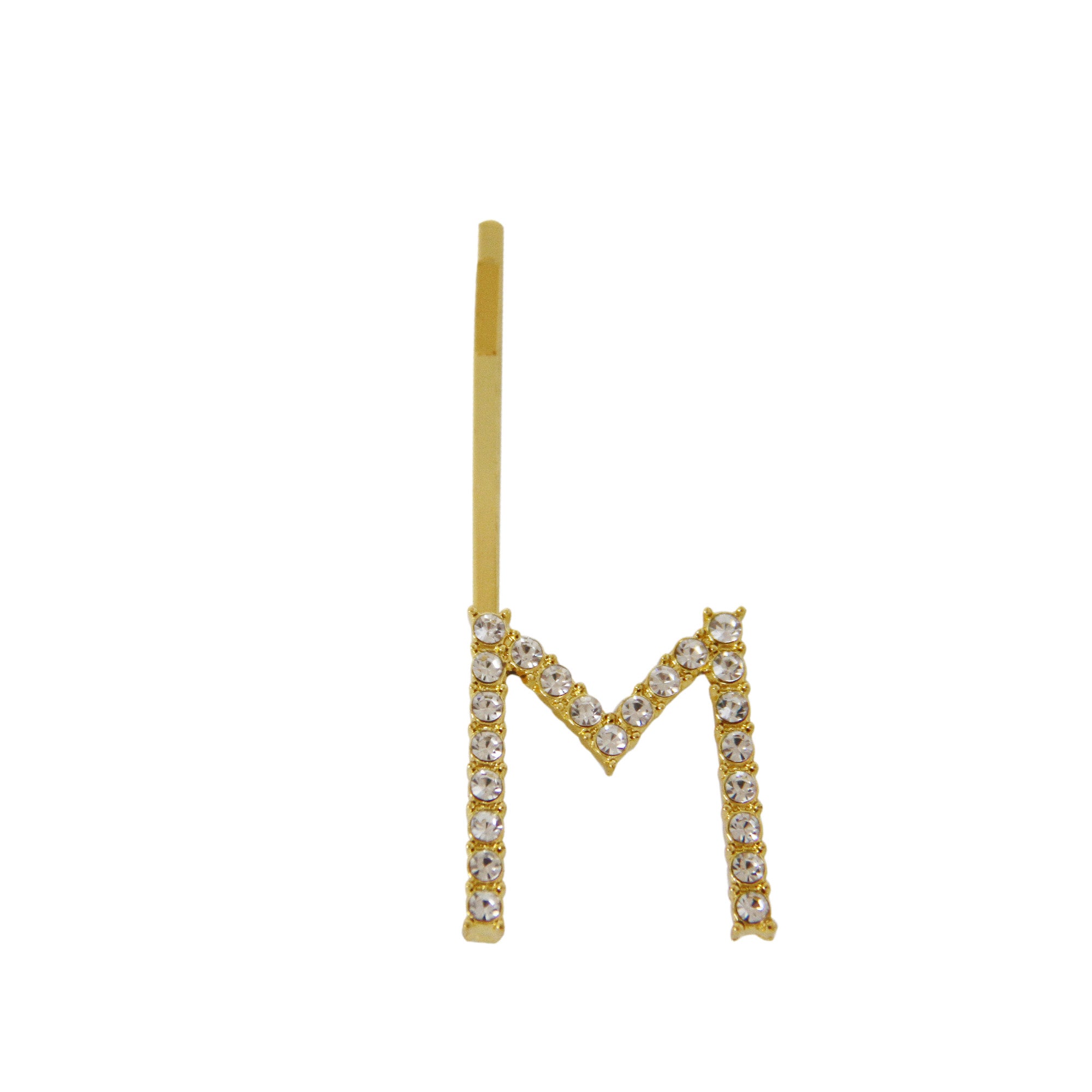 Gold and crystal letter 'M' hair slide on a white background