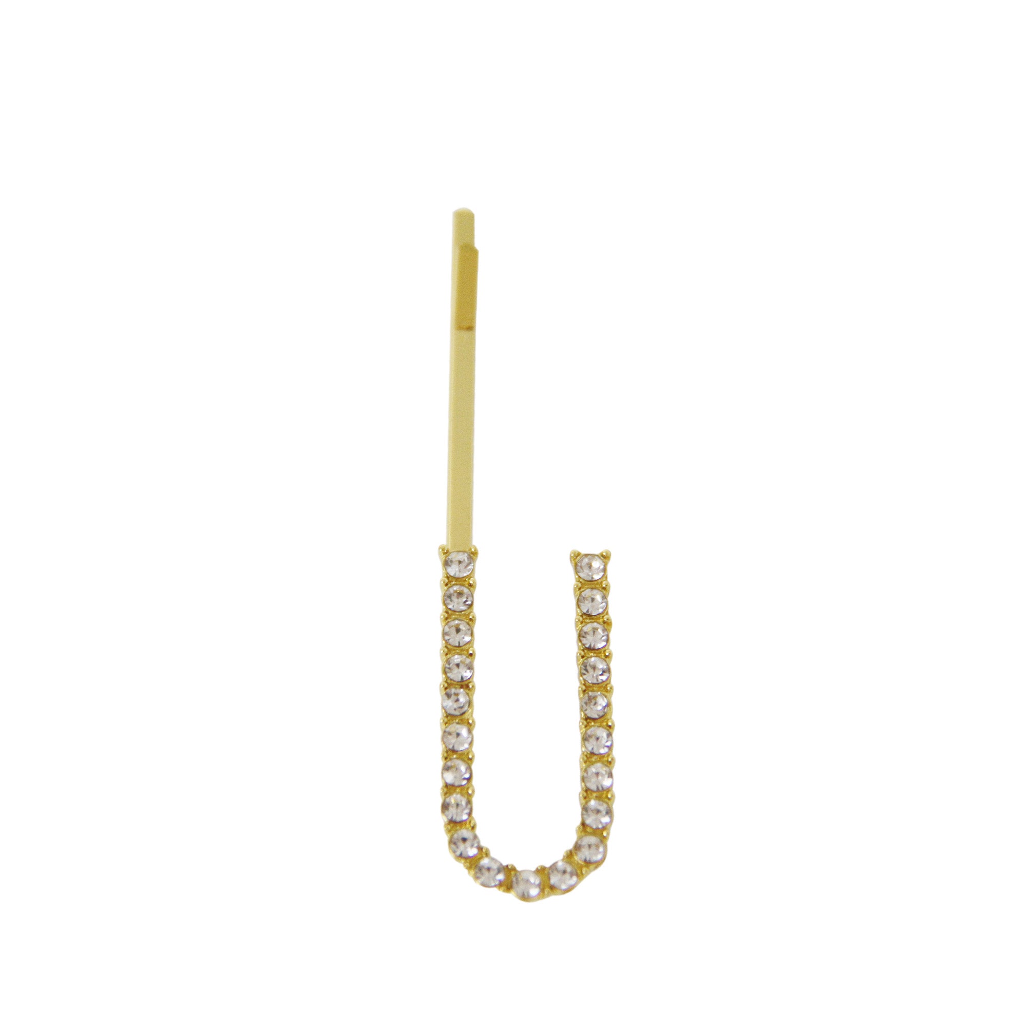Gold and crystal letter 'U' hair slide on a white background