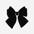 Black Velvet Hair Bow featuring a crystal detail in the center on an off white background