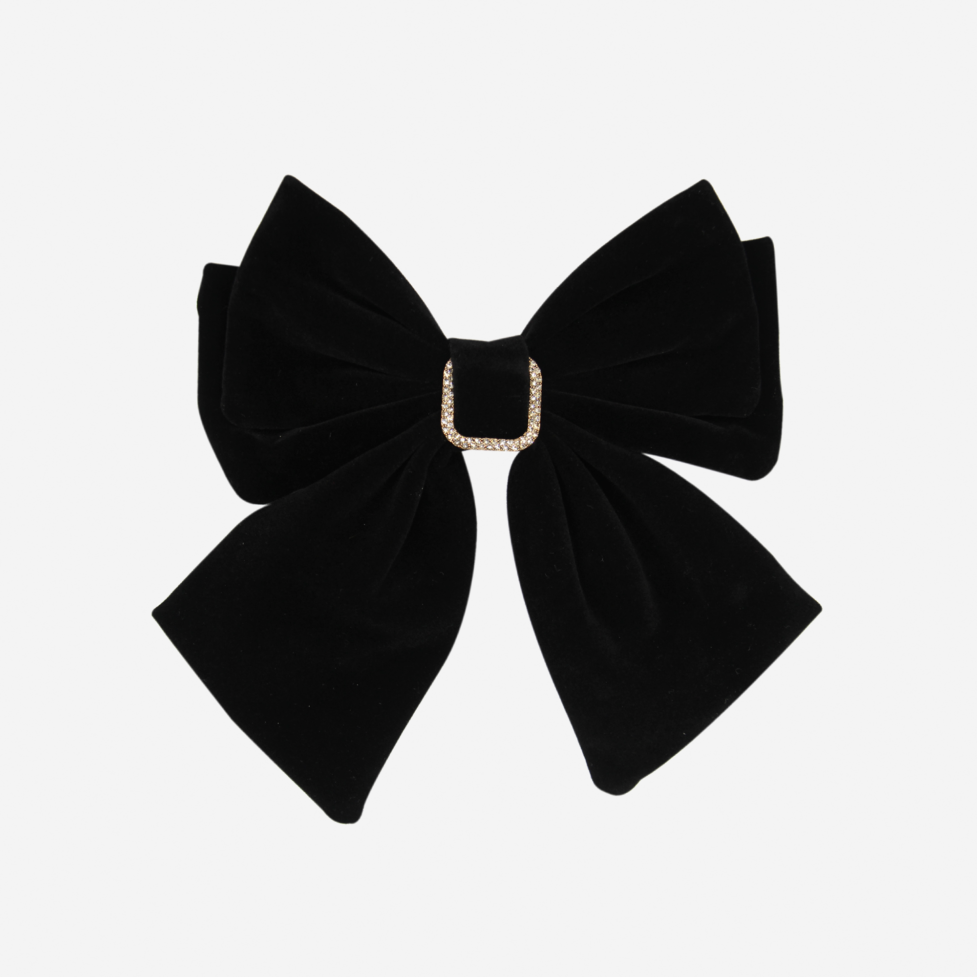 Black Velvet Hair Bow featuring a crystal detail in the center on an off white background
