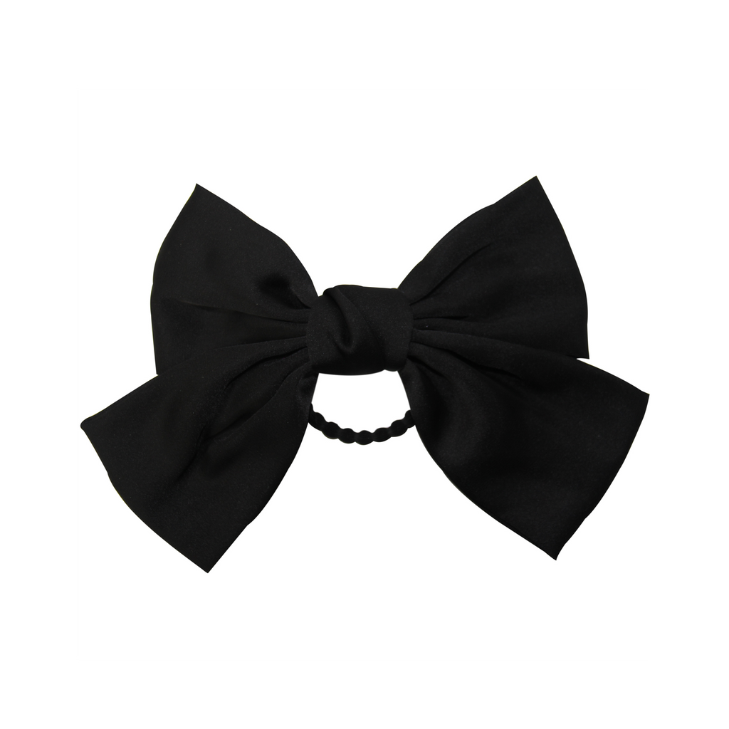 Black bow hair tie on a white background