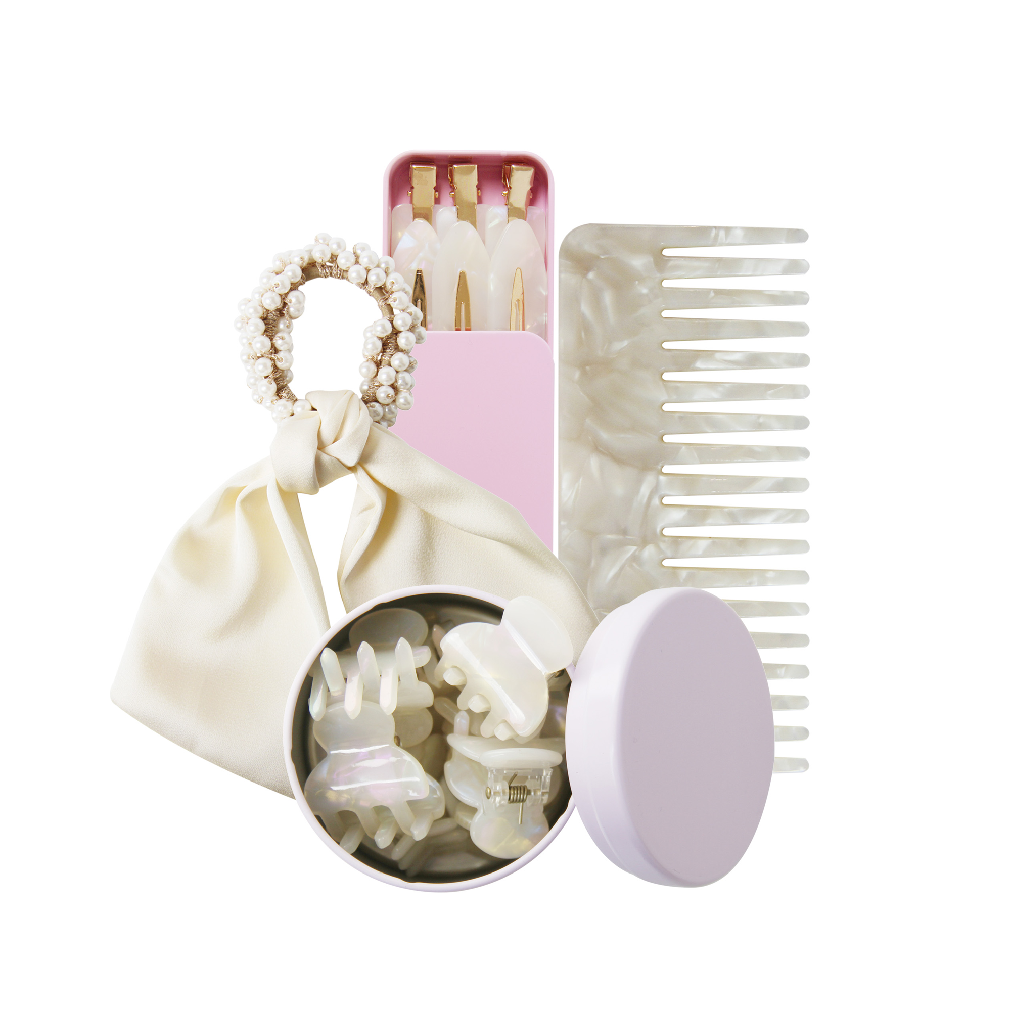 Set of hair accessories including a wide tooth resin comb, hair ties, and clips in a pink tin on a white background.