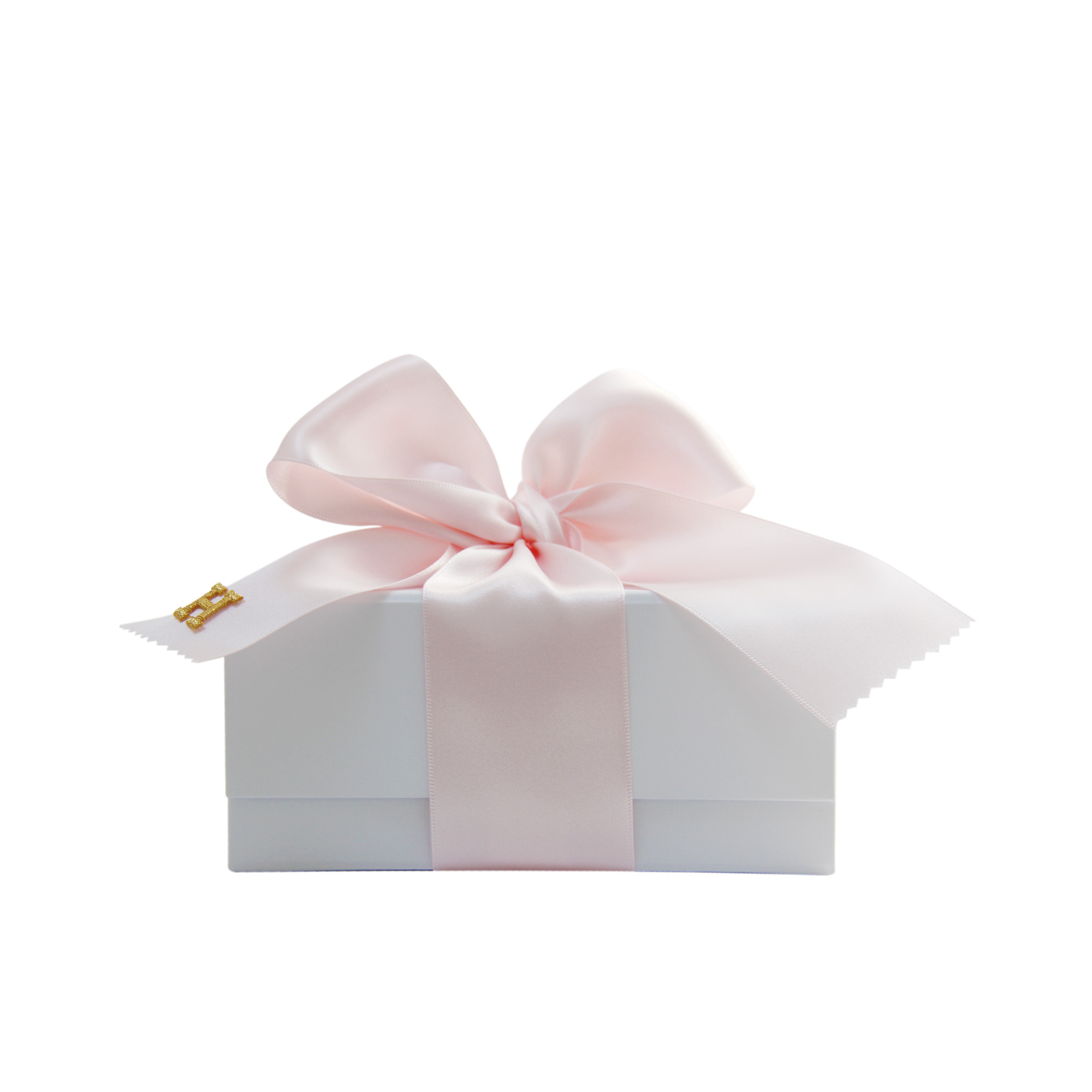 White gift box with a pink ribbon, which has been monogrammed with a gold embroidered H on a white background