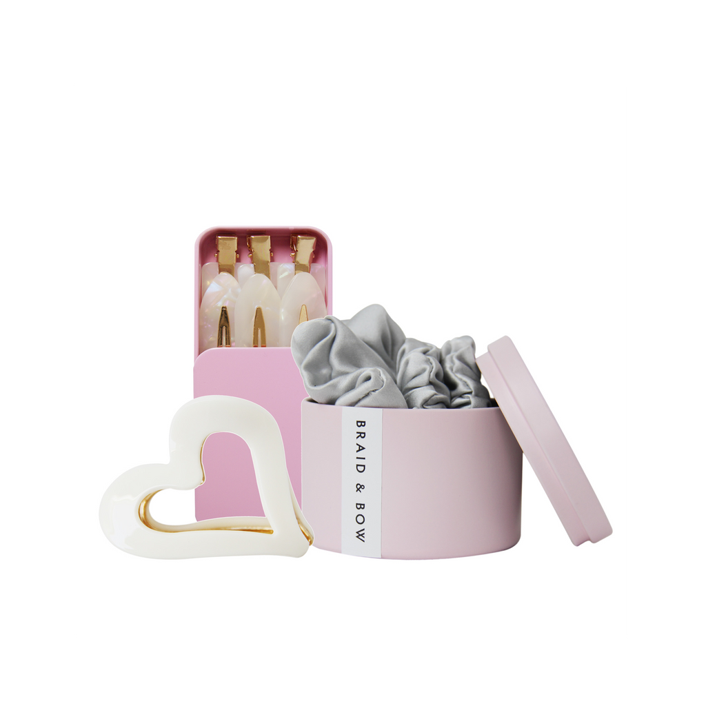 Set of hair accessories, showing  silver silk hair scrunchies, set of 6 non crease hair clips and cream heart hair claw on a white background