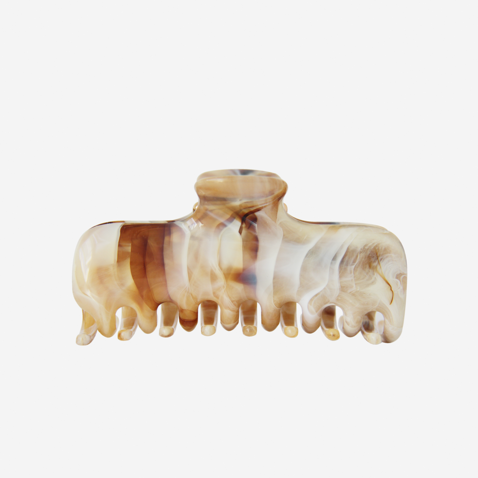 Marbled brown and beige patterned hair claw on an off white background