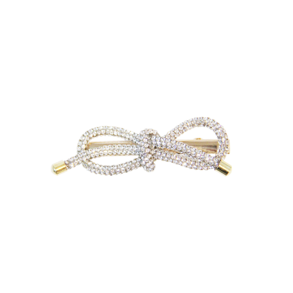 Gold and crystal bow-shaped hair clip on a white background