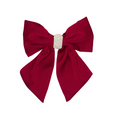 Red hair bow with a crystal pave center on a white background
