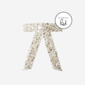 Crystal encrusted cream velvet hair bow on an off white background featuring an as seen in Red magazine logo