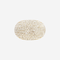 Oval Gold and crystal pave ponytail holder on an off white background