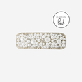 Pearl and crystal rectangle hair clip, with an as seen in Red Magazine logo, on an off white background