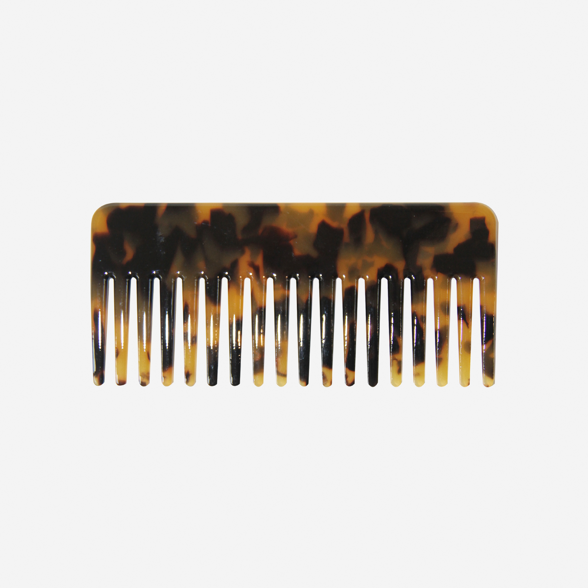 Dark Tortoiseshell Wide Tooth Resin Hair Comb on an off white background