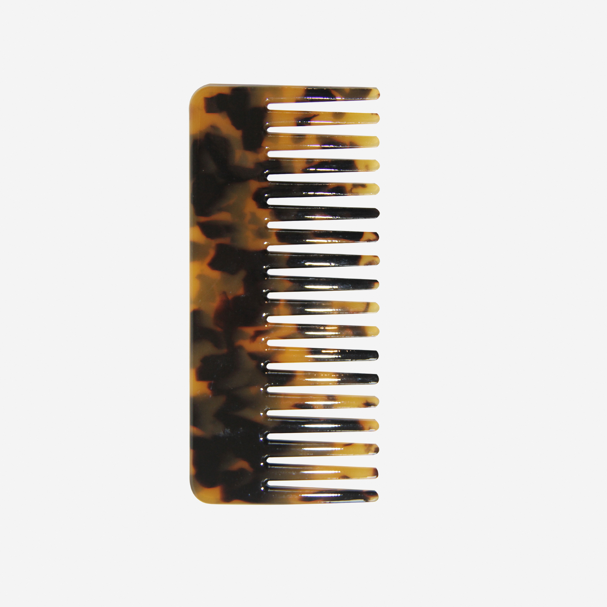 Dark Tortoiseshell Wide tooth hair comb on an off white background