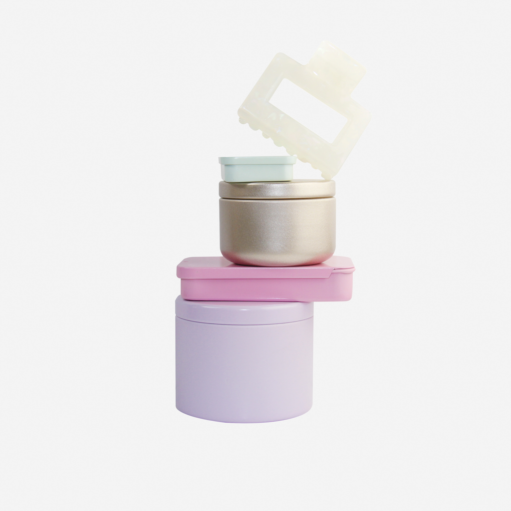 Curated pastel hair accessory gift set including non crease hair clips, mini hair claws, hair ties, kirby grips and a medium sized hair claw, in keepsake tins and packaged in a beautiful gift box.
