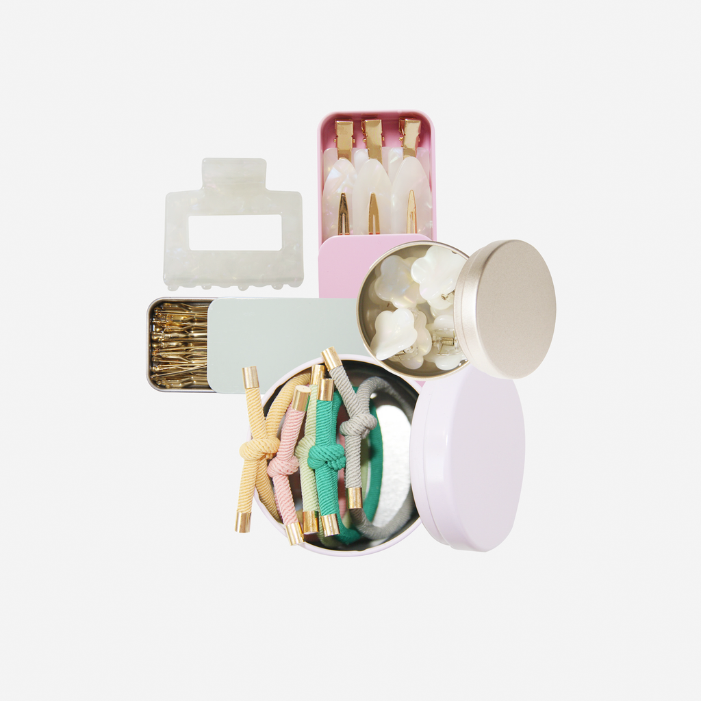 Curated pastel hair accessory gift set including non crease hair clips, mini hair claws, hair ties, kirby grips and a medium sized hair claw, in keepsake tins and packaged in a beautiful gift box.