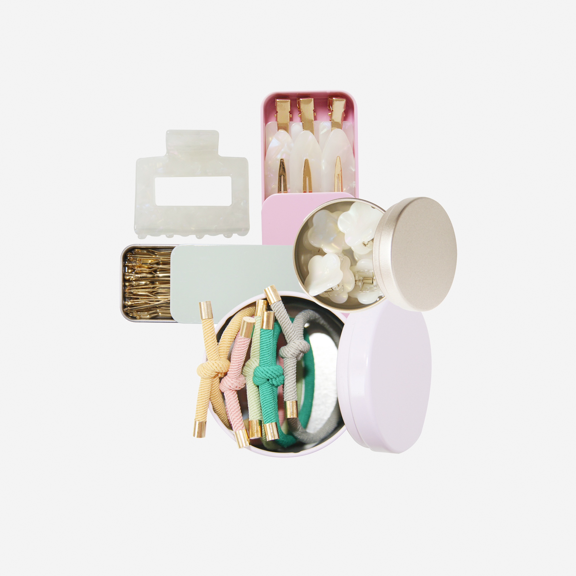 Curated pastel hair accessory gift set including non crease hair clips, mini hair claws, hair ties, kirby grips and a medium sized hair claw, in keepsake tins and packaged in a beautiful gift box.