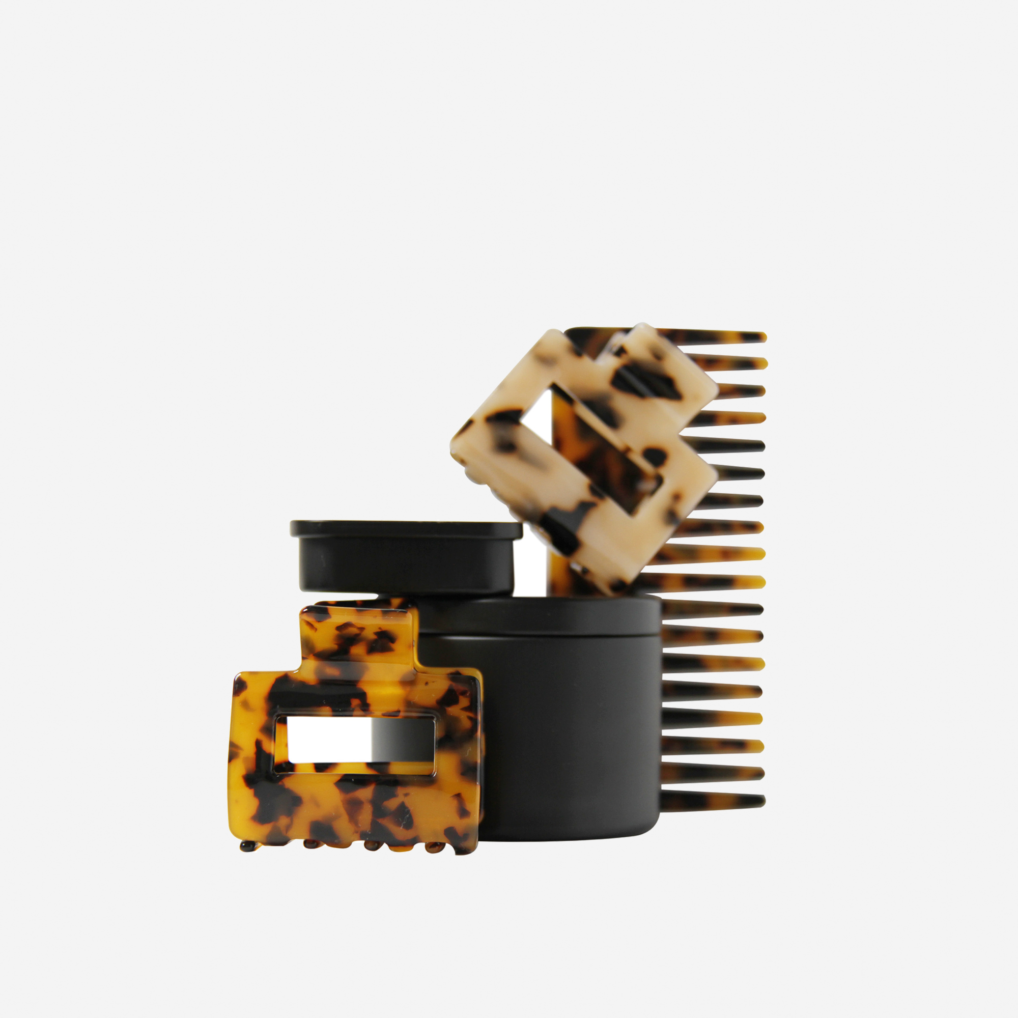 Curated tortoiseshell hair accessory gift set including non crease hair clips, hair claws, mini hair claws and hair comb, in keepsake tins and packaged in a beautiful gift box.