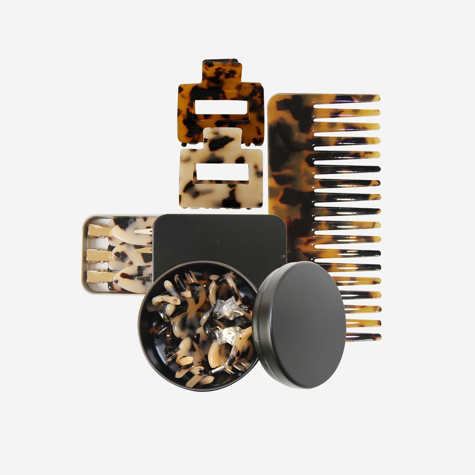 Curated tortoiseshell hair accessory gift set including non crease hair clips, hair claws, mini hair claws and hair comb, in keepsake tins and packaged in a beautiful gift box.