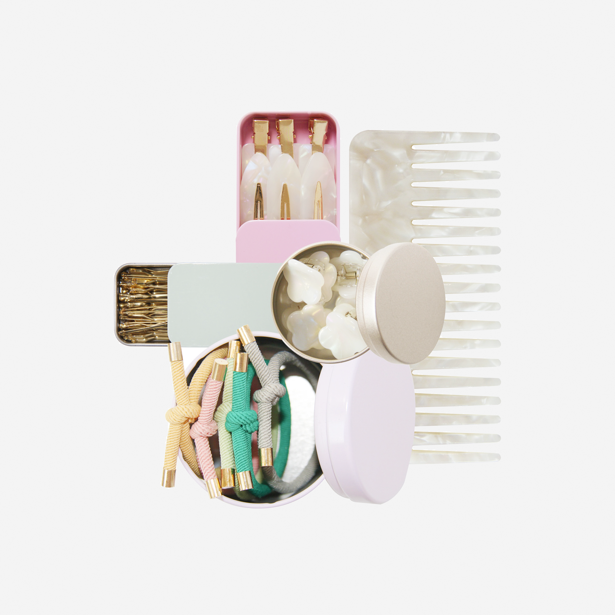 Curated pastel hair accessory gift set including non crease hair clips, mini hair claws, hair ties, kirby grips and a hair comb, in keepsake tins and packaged in a beautiful gift box.