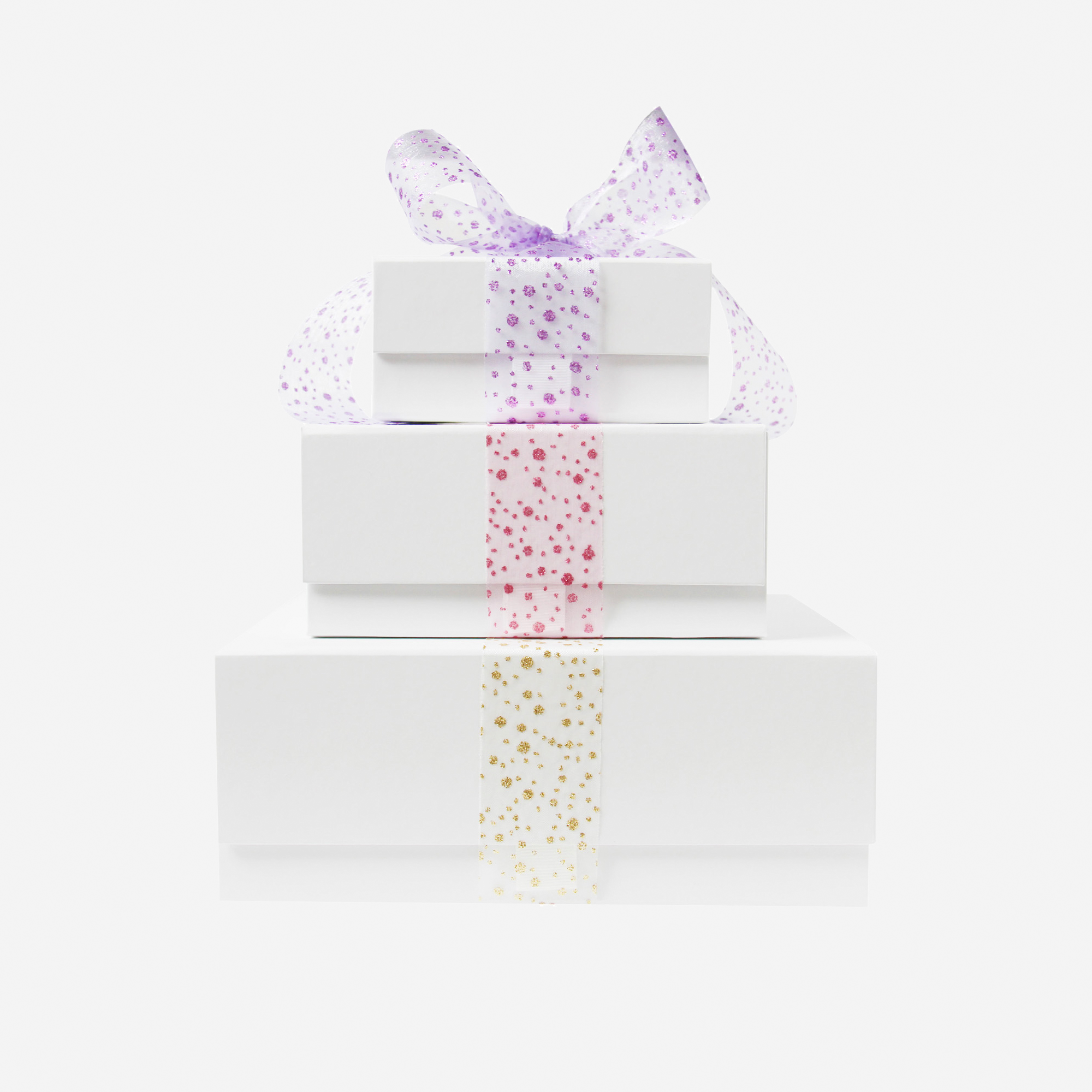 Stack of white gift boxes with solourful glitter organza ribbons fir Braid and Bow Gift Sets
