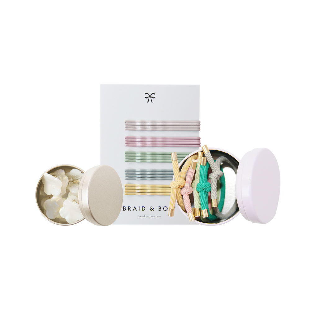 Set of hair accessories including hair ties and clips with a 'Braid & Bow' packaging on a white background.