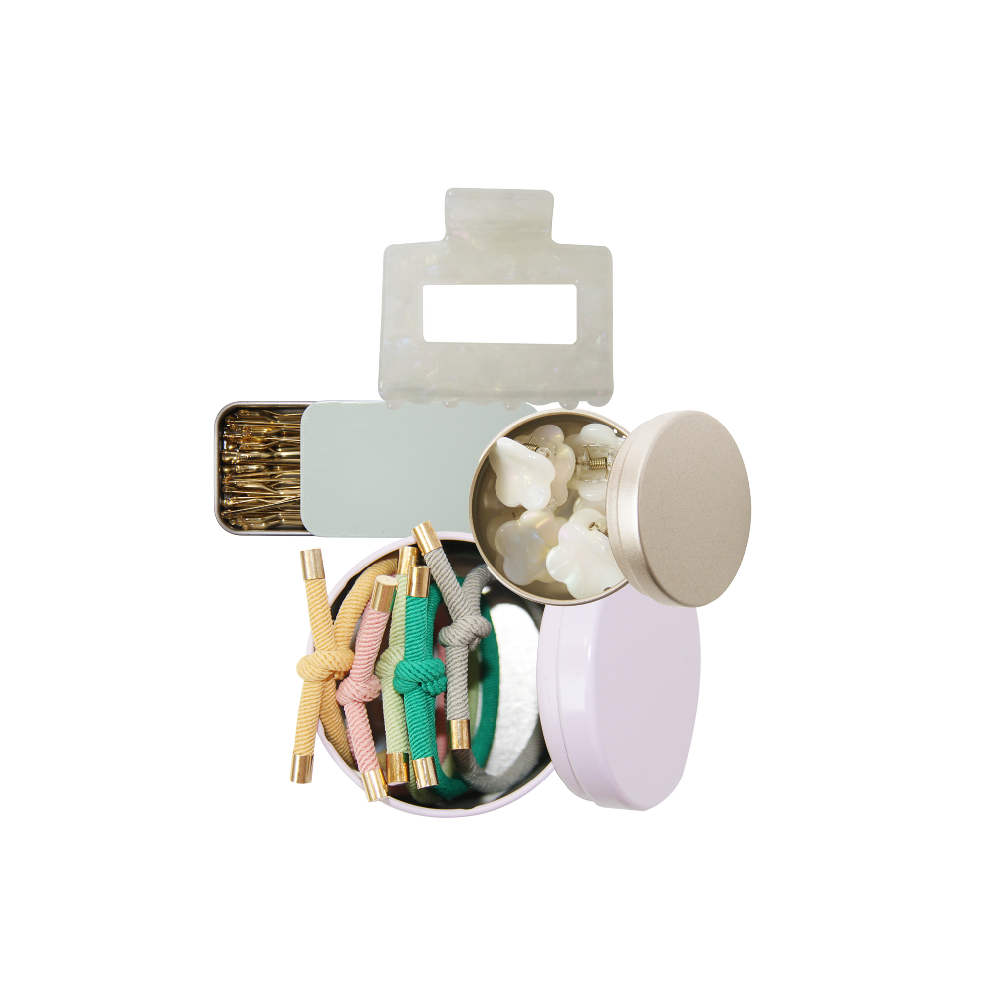 Set of hair accessories, showing hair ties, mini hair claws, kirby grips and a hair claw on a white background