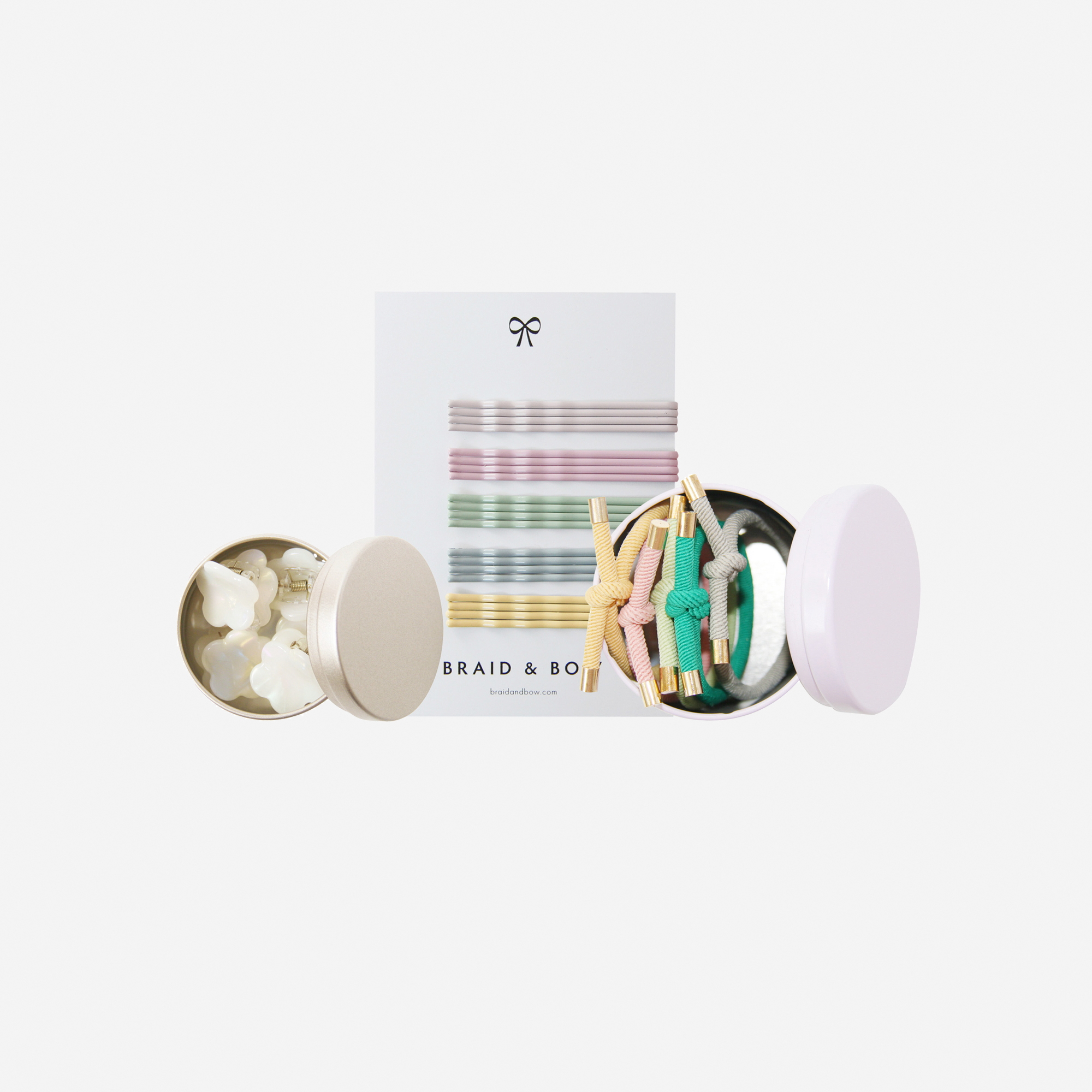 Curated hair accessory set including pastel hair slides, hair ties and hair claws, in keepsake tins and packaged in a beautiful gift box.