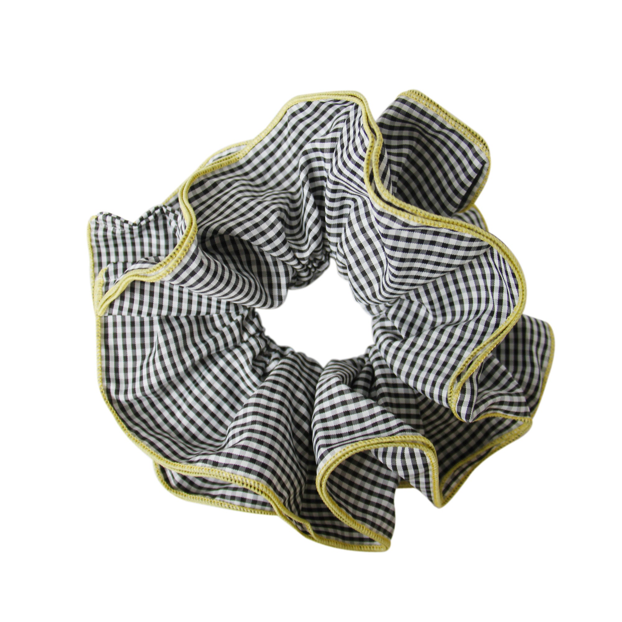 Black gingham scrunchie with a yellow trim on a white background