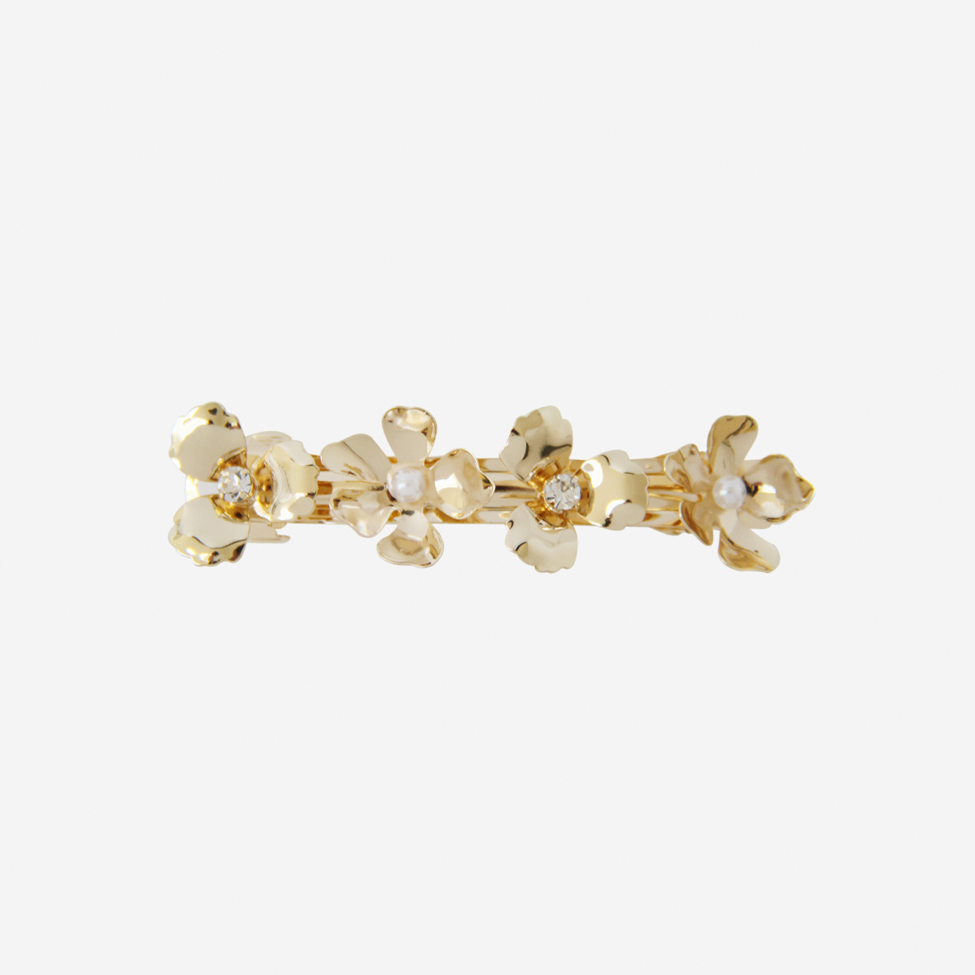 Gold flower hair barrette, with alternating crystals and pearls in the center of the flowers on an off white background