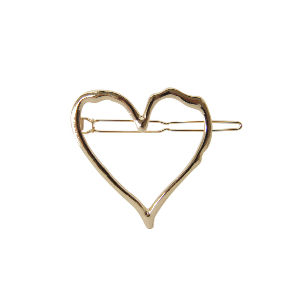 Gold heart-shaped hair clip on a white background