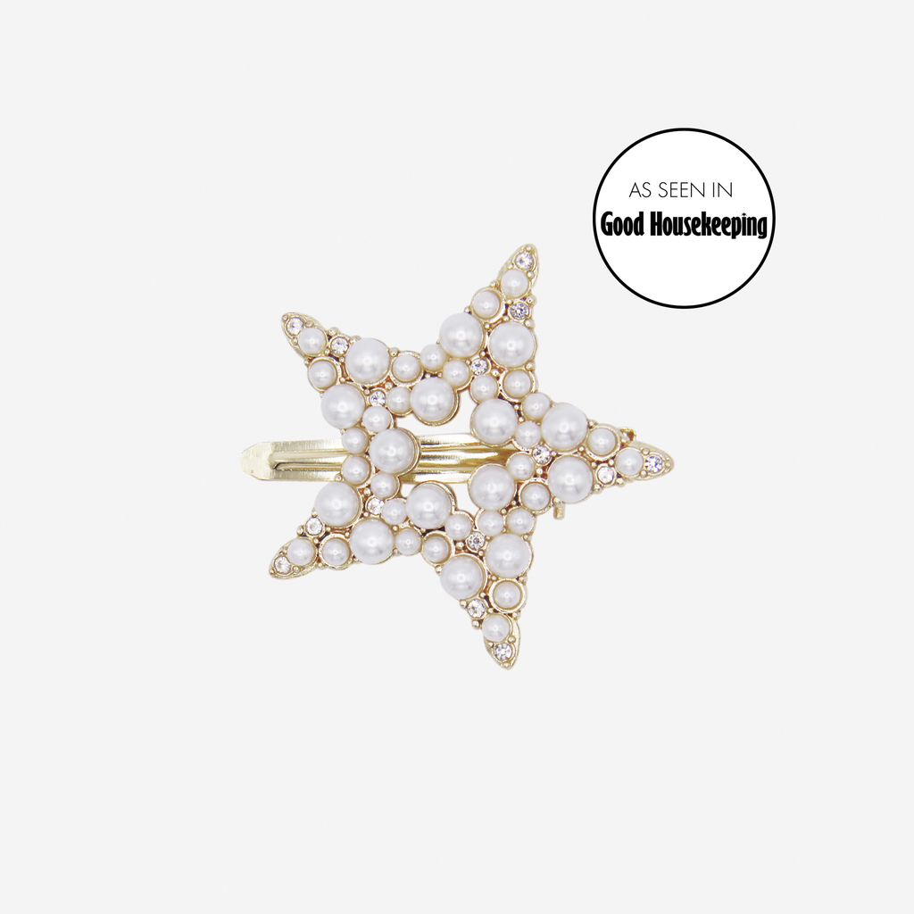 Gold and pearl hair clip, featuring an as seen in Good Housekeeping logo on an off white background