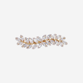Crystal and gold hair clip that's designed like ivy on an off white background