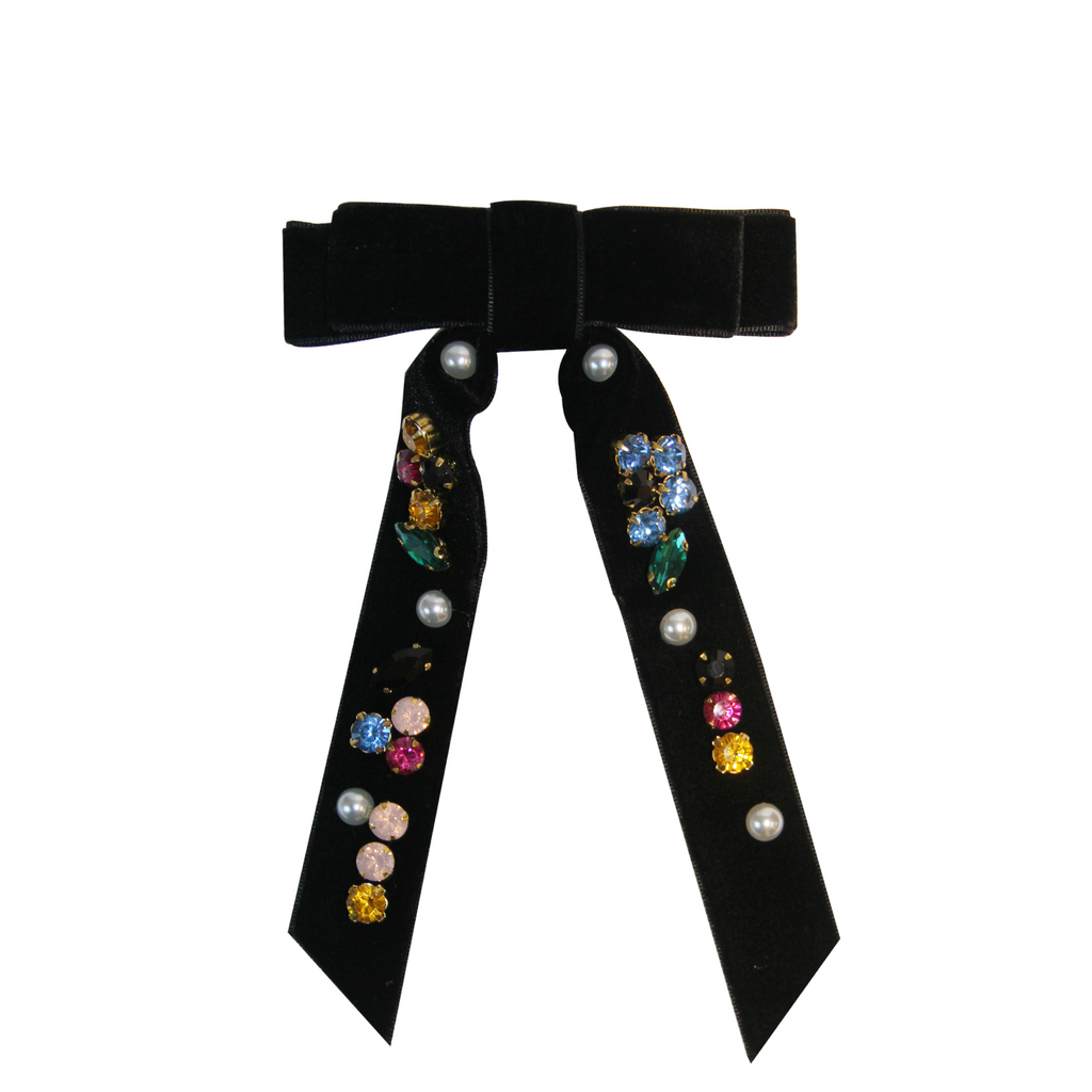 Black velvet jewelled hair bow with colorful gemstones on a white background