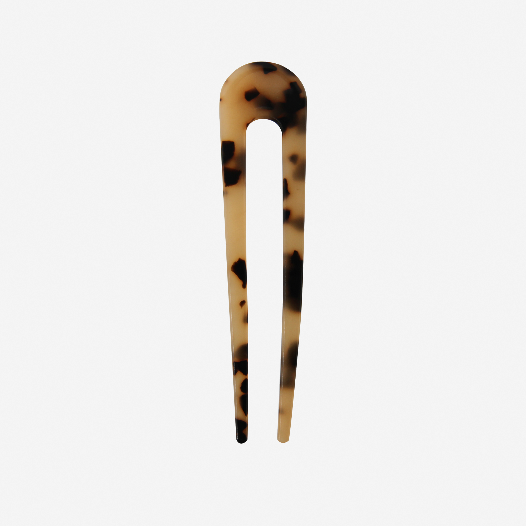 Light Tortoiseshell French Hair Pin on an off white background
