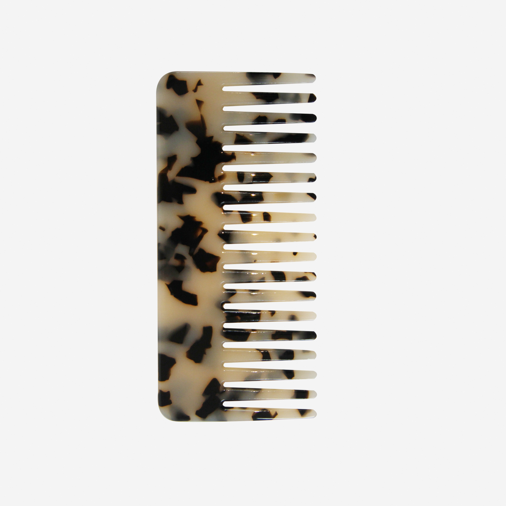 Light Tortoiseshell Wide Tooth Hair Comb on an off white background