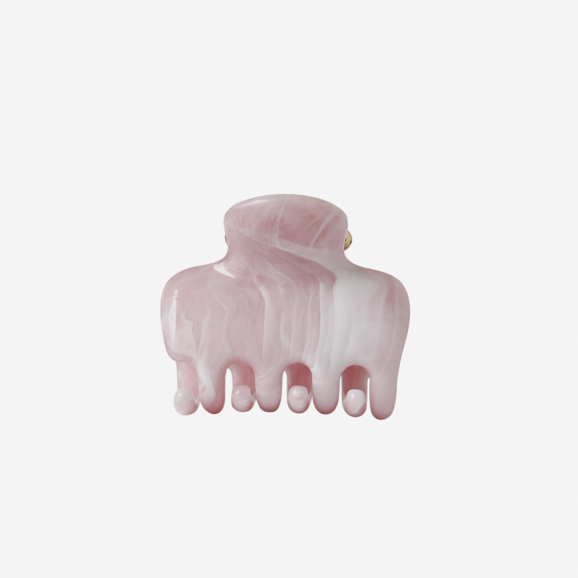 Pink marble hair claw on an off white background
