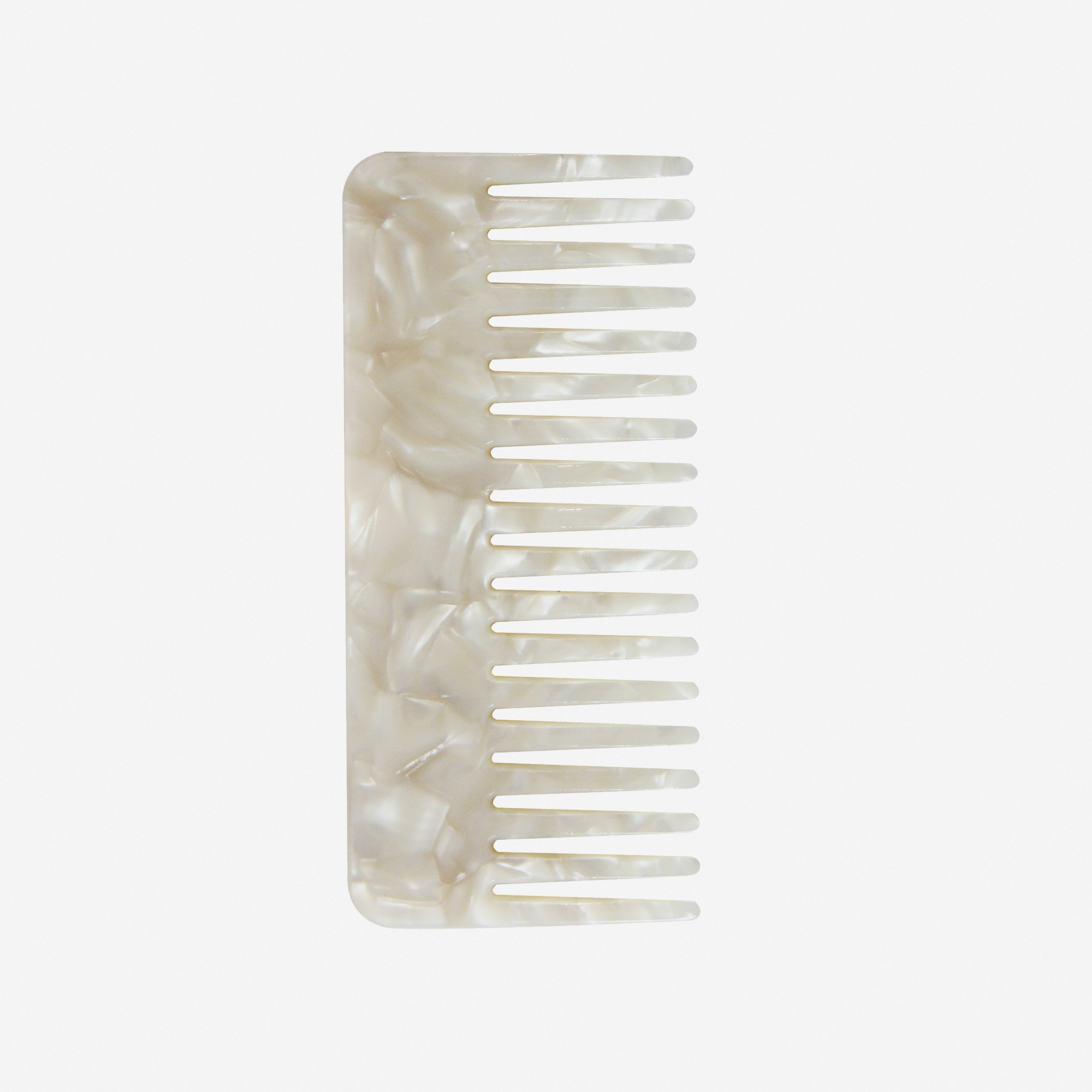 Wide tooth mother of pearl resin hair comb on an off white background