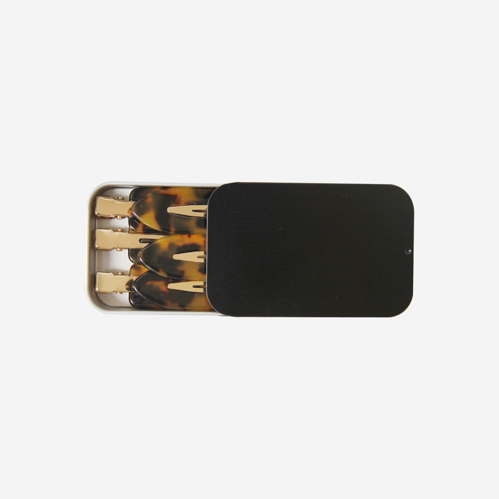 Set of 6 dark tortoiseshell non crease hair clips  in a pink tin, on an off white background