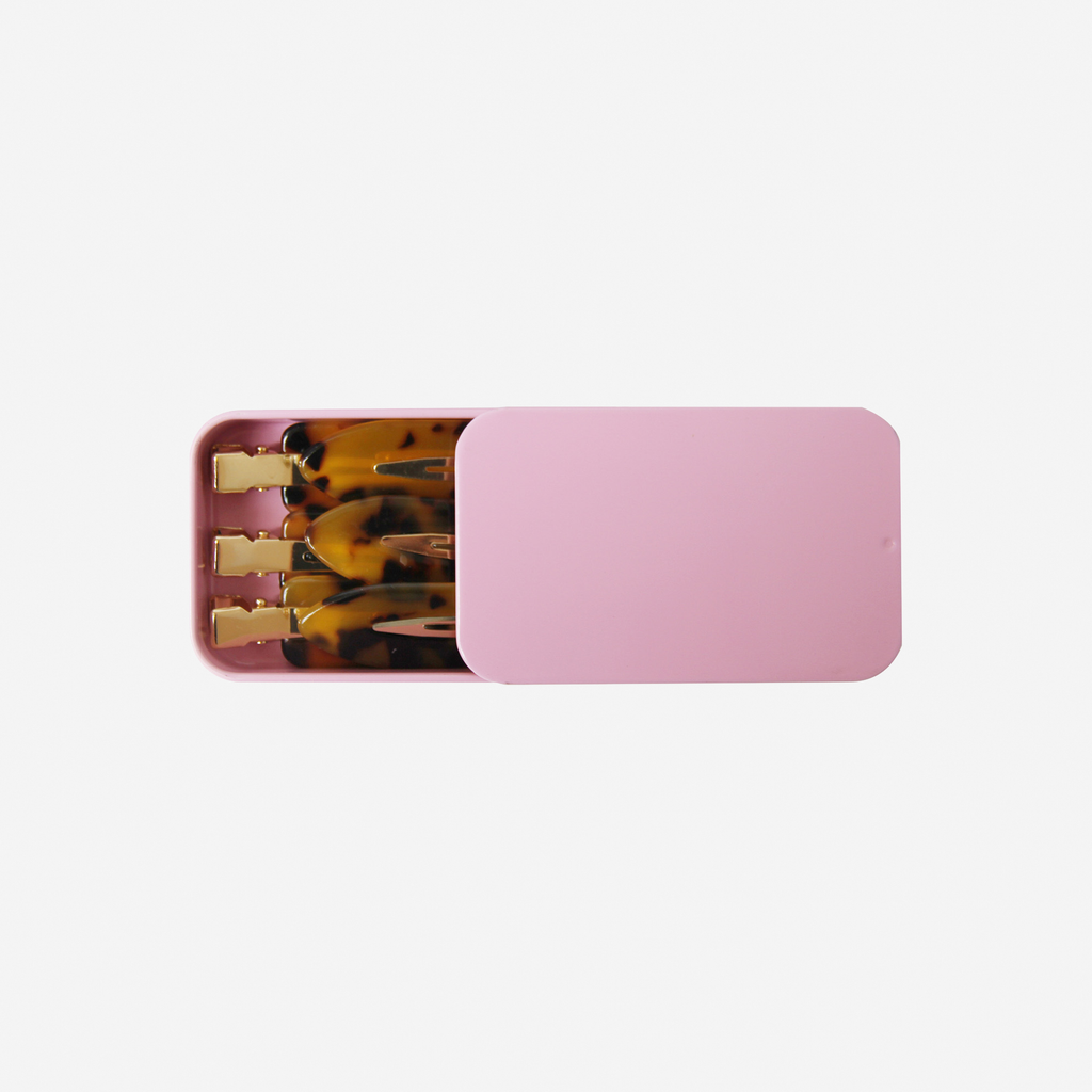 Set of 6 dark tortoiseshell non crease hair clips  in a pink tin, on an off white background