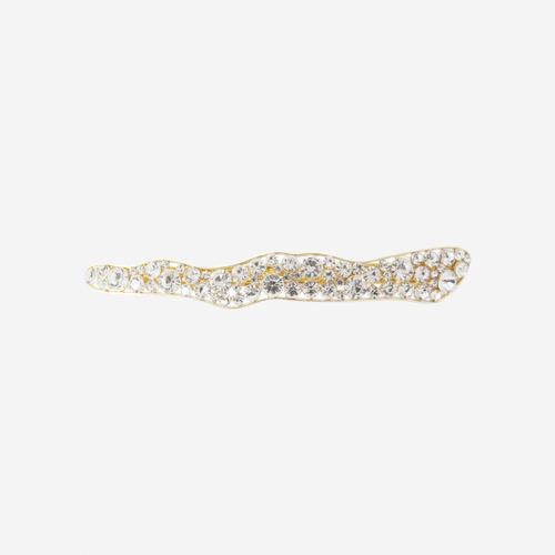 elongated pearl and crystal hair clip with an organic shape on an off white background