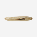 Gold hair clip with an organic shape on a white background