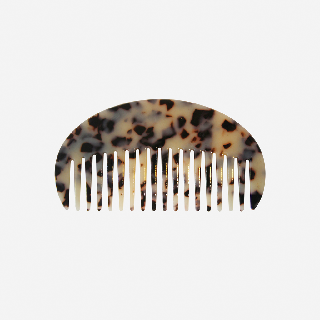 Oval light tortoiseshell wide tooth resin hair comb that's great for detangling and styling