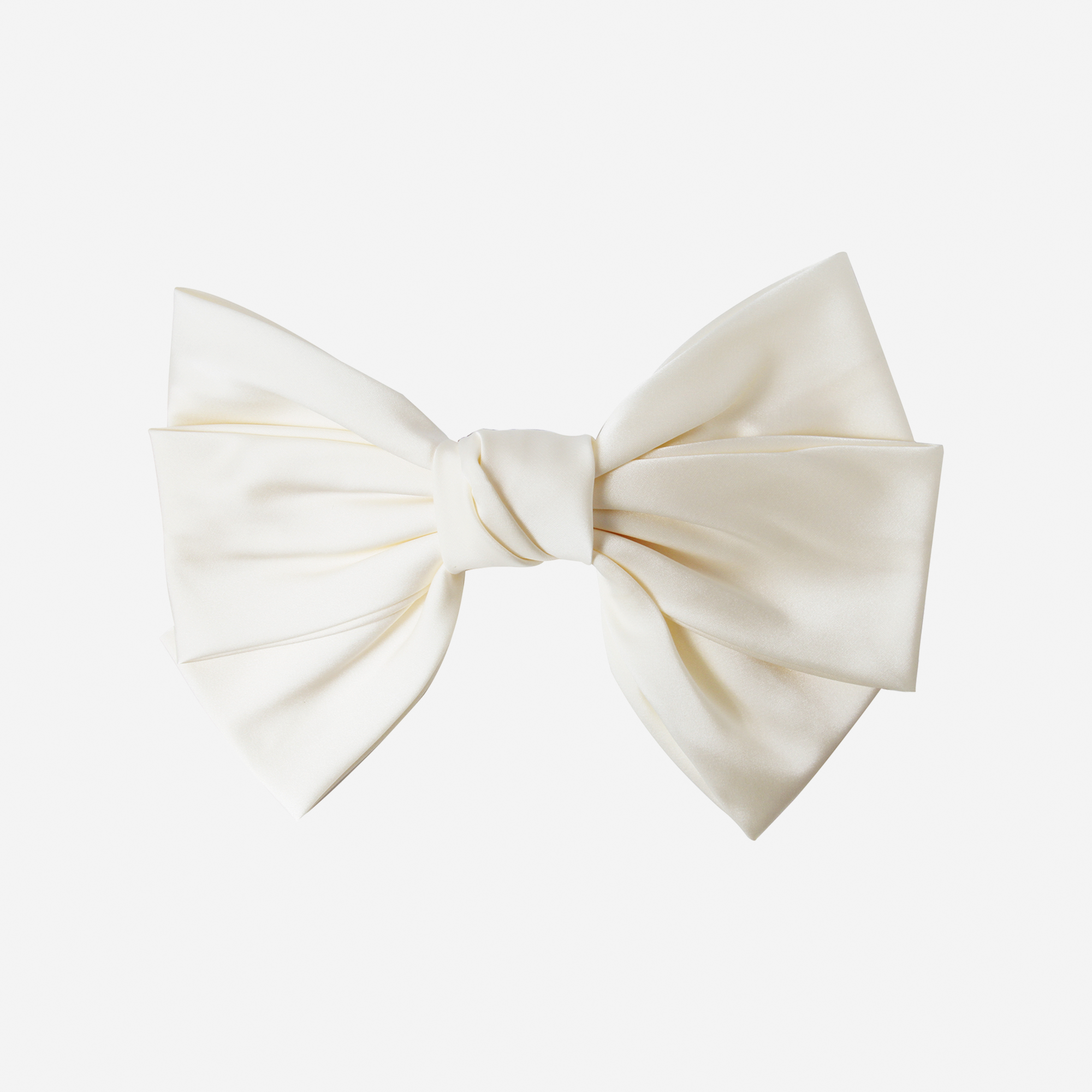 Large cream hair bow on an off white background